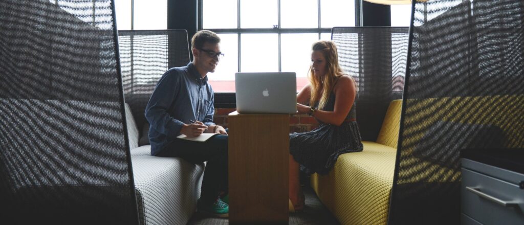 Tech Recruitment Interview with Man and Woman Over Apple Product